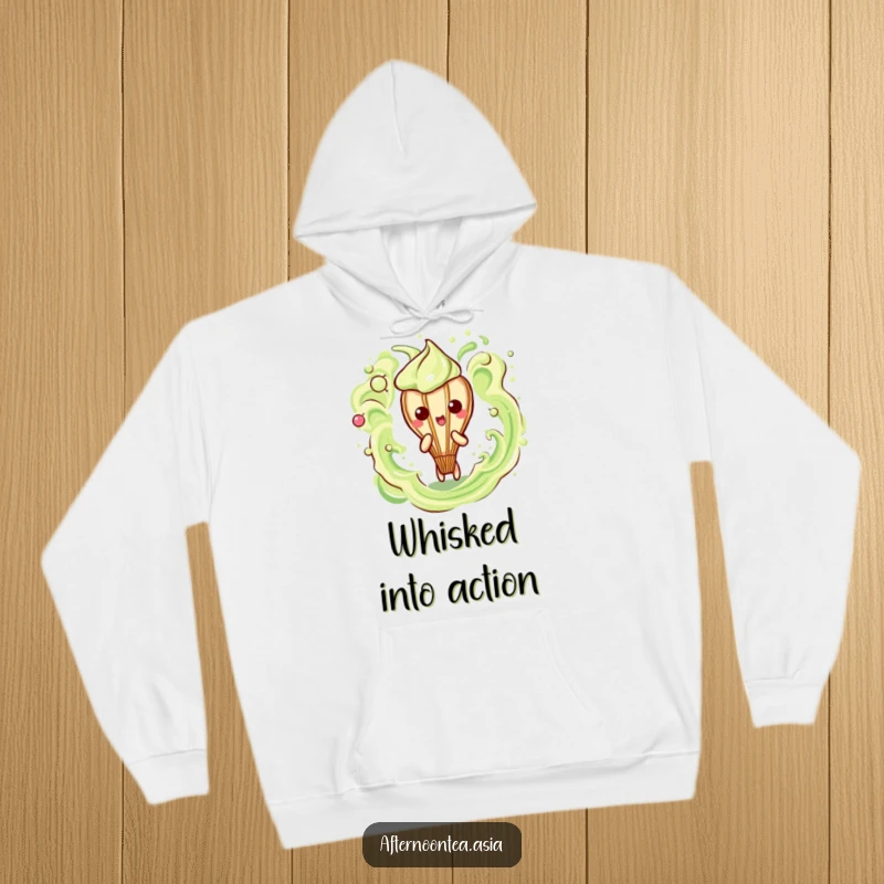 Funny Kawaii Matcha Whisk Hoodie: A cute character creating frothy art, perfect for cozy wear and as a funny gift.